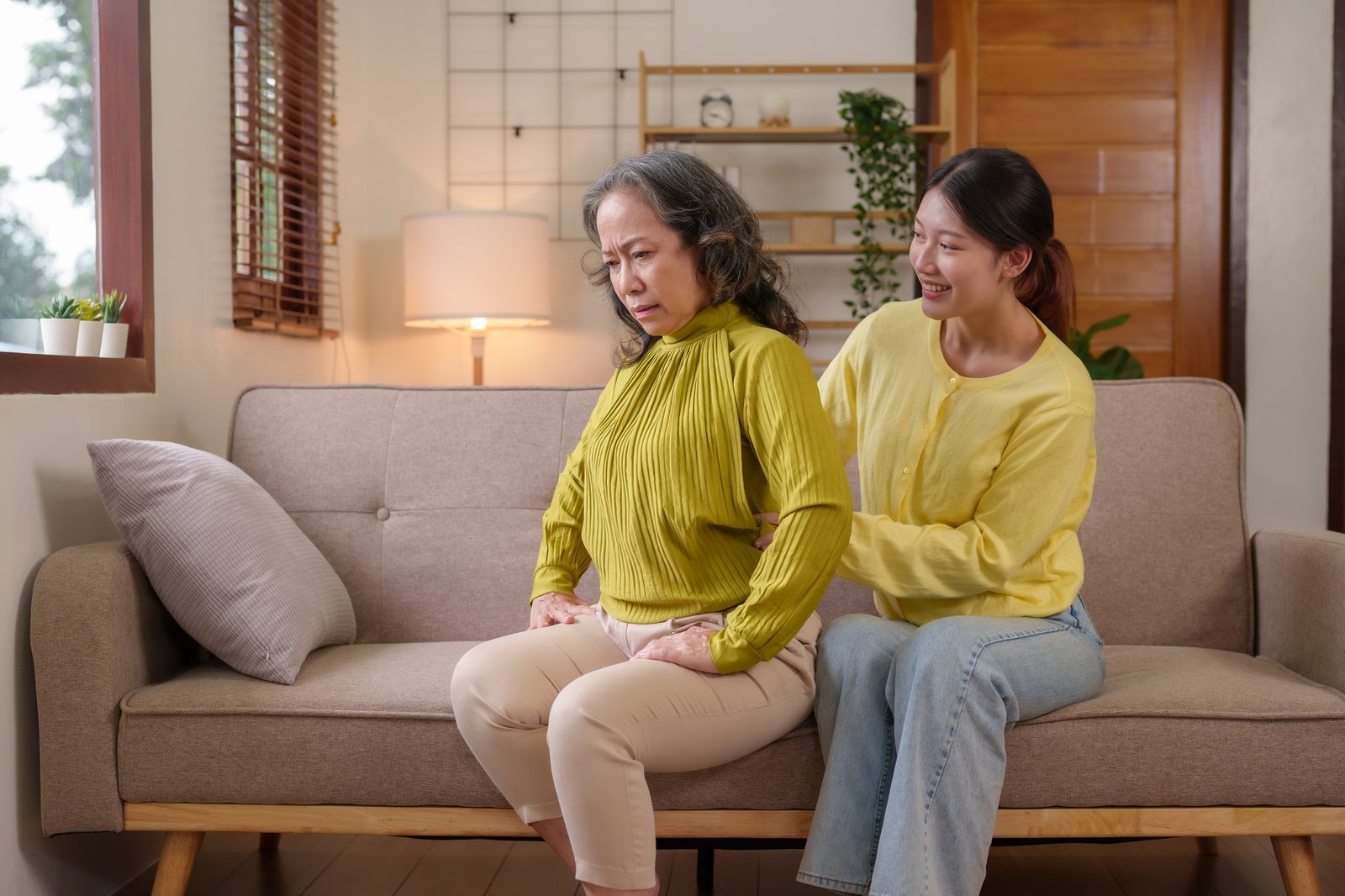 Adult child and parent in warm conversation