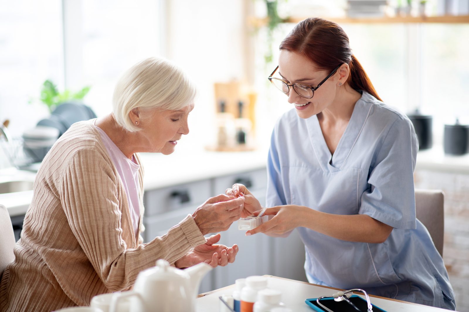 Caregiver helping naturally with an everyday activity at home