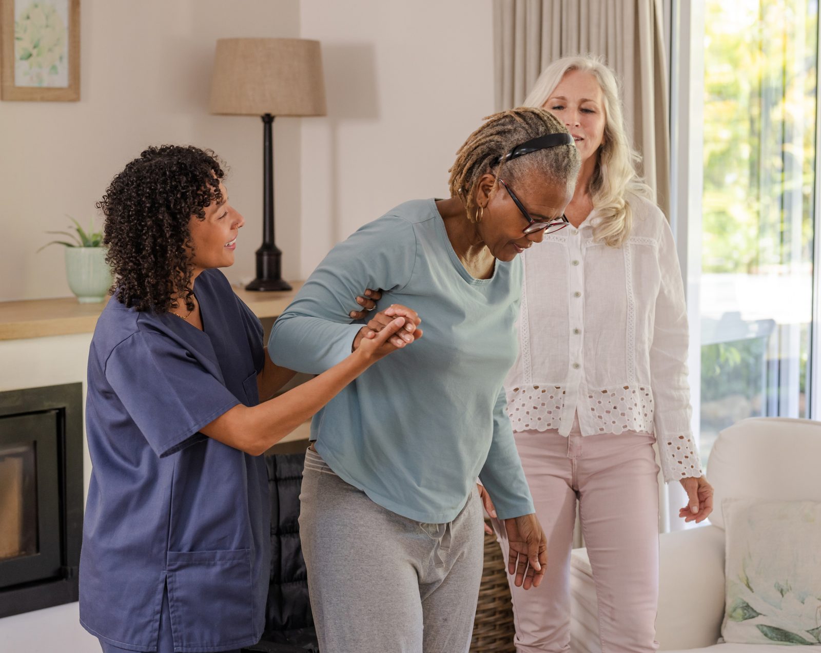 Caregiver and family helping an older adult, warm social support